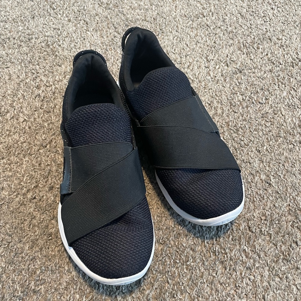 Under Armour Women’s Black Slip-On Sneakers with White Soles